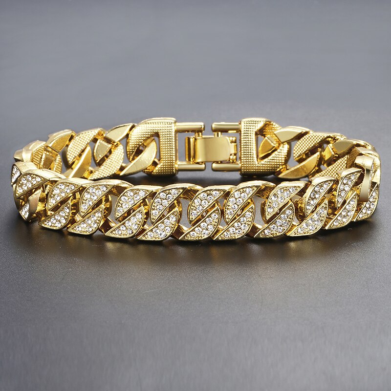 Miami Gold Curb Cuban Bracelet with pave setting on black surface.